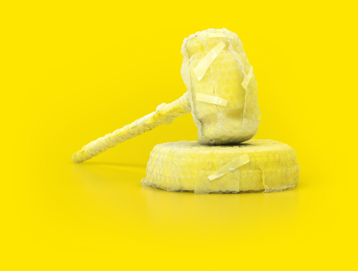 Gavel of the president of a court of law wrapped in bubble wrap